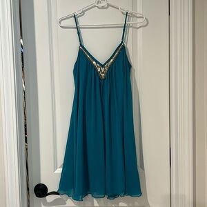 Express teal blue spaghetti strap chiffon flowy dress with gold accent.